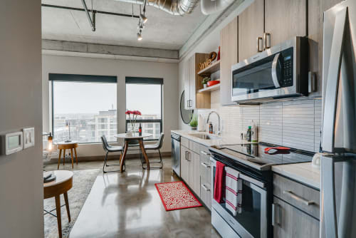 A modern kitchen with an urban view and stylish decor.