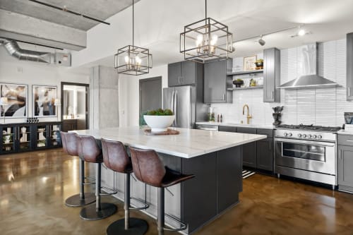 A modern kitchen showcasing industrial design and stylish decor.