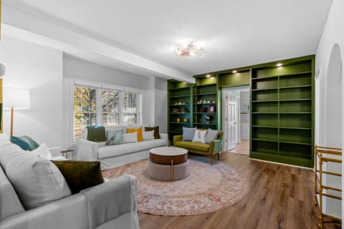 A cozy and stylish living room with a blend of modern and traditional elements.