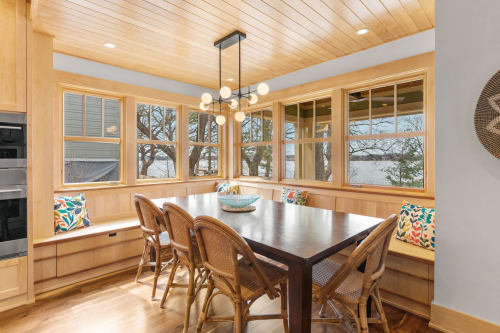A stylish dining area with lake views and colorful decor.