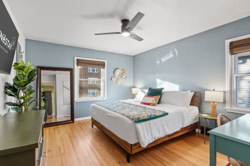 Bright and cozy bedroom featuring modern decor and natural light.