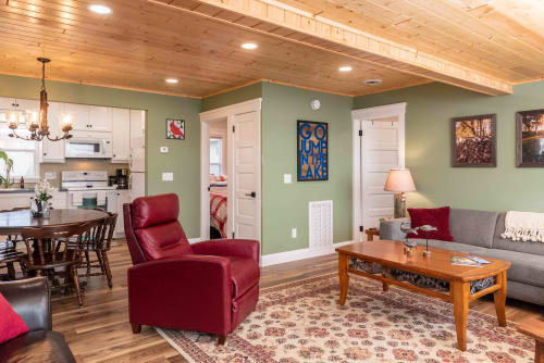 A cozy living area featuring modern decor and rustic elements, perfect for relaxation.