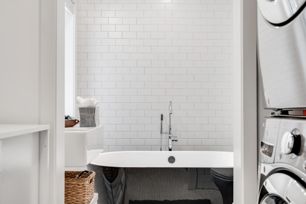 Modern bathroom with a free-standing bathtub and contemporary design elements.