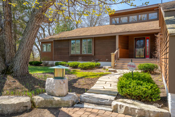 Contemporary house front with stone path and garden