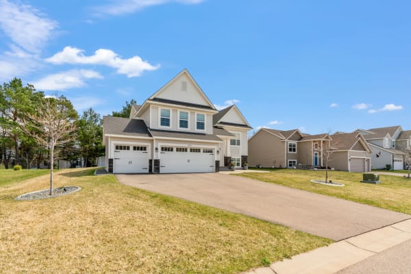 Contemporary two-story house with a garage in a suburb.