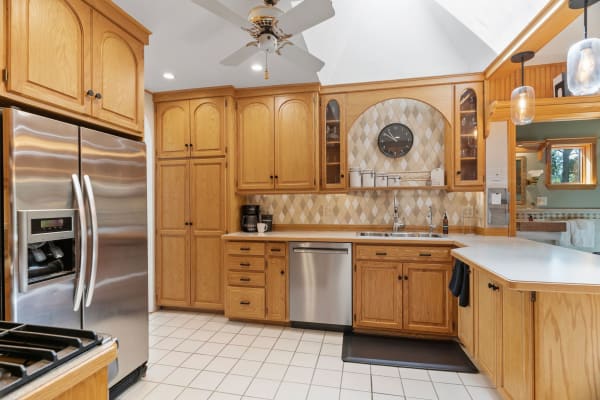 An inviting kitchen with oak cabinets and modern appliances.