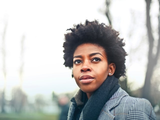 A young woman gazing thoughtfully into the distance