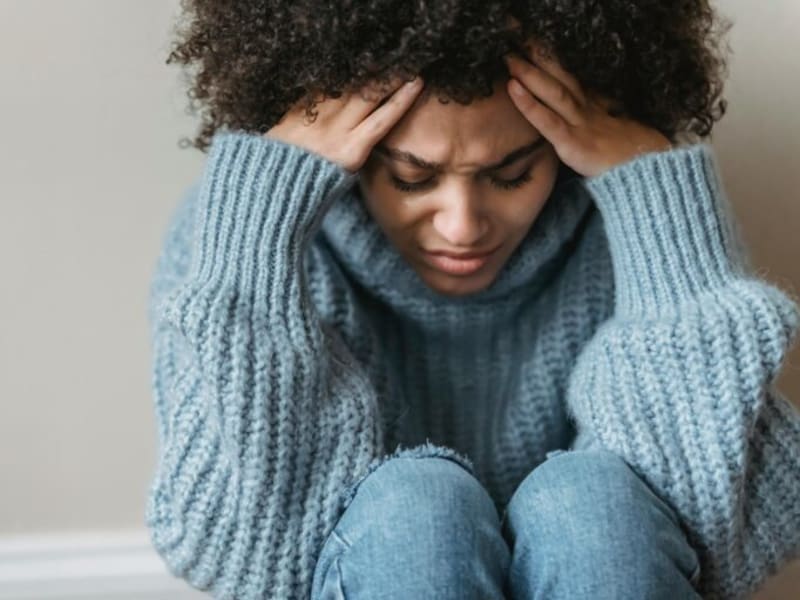 A person pausing in a moment of overwhelm