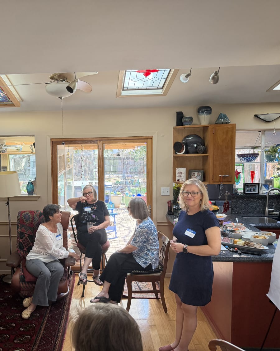 Guests at a Gatherings For Good event in a living room