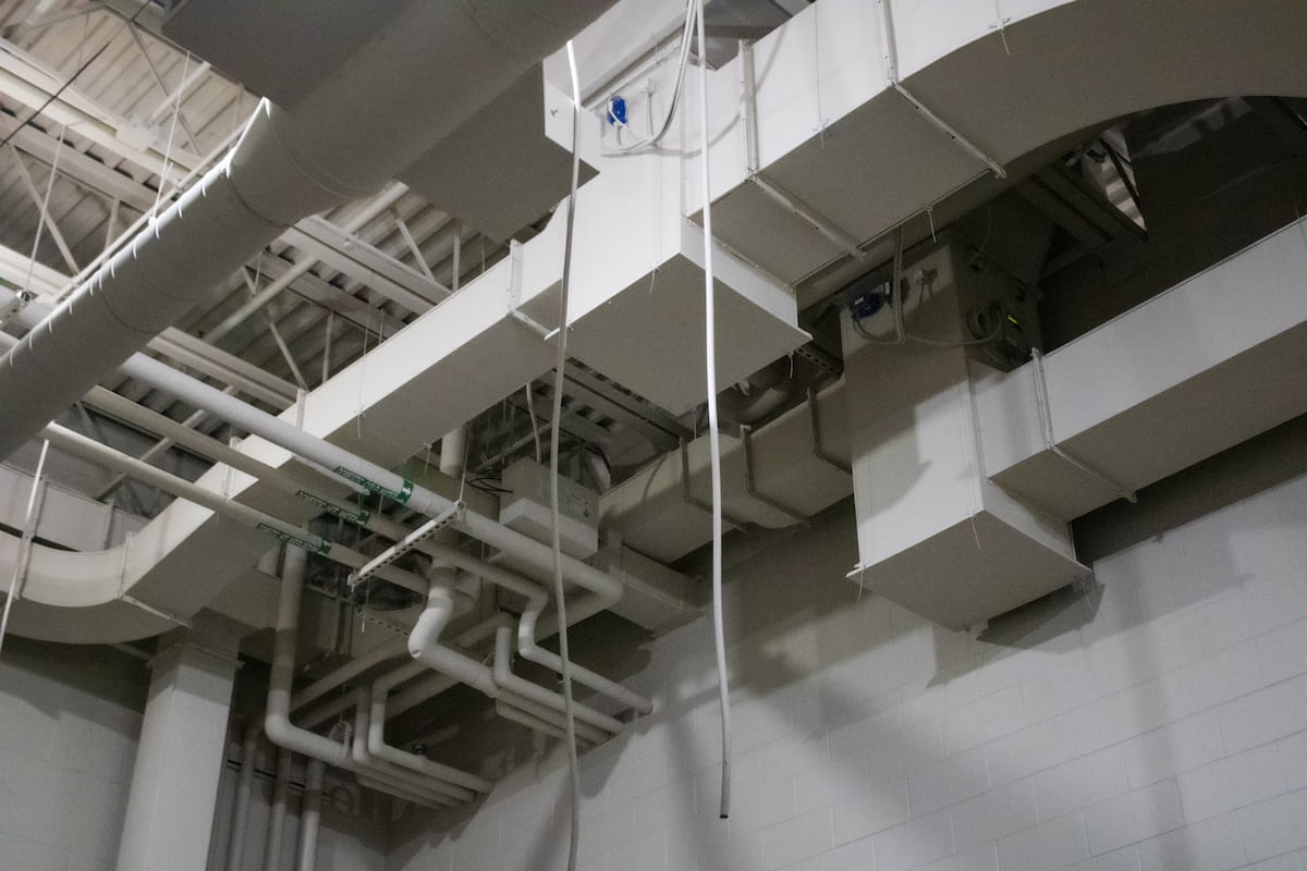 white HVAC duct work and piping