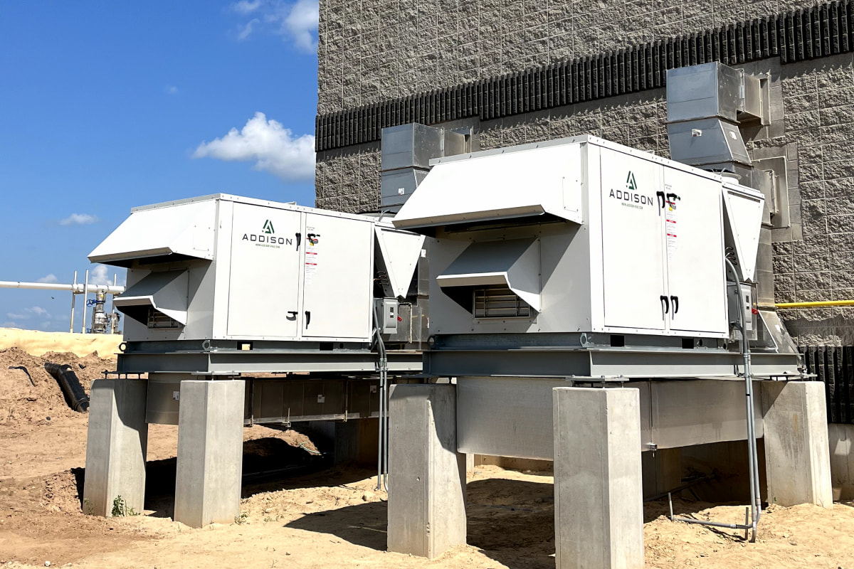 Two Addison HVAC units installed on concrete pads at Zahn Farm commercial facility