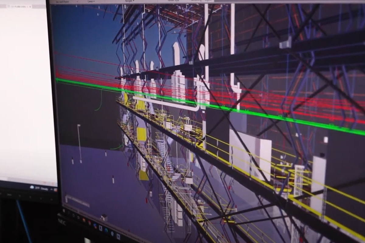 3D BIM model showing coordinated mechanical, electrical, and structural systems in an industrial facility layout.
