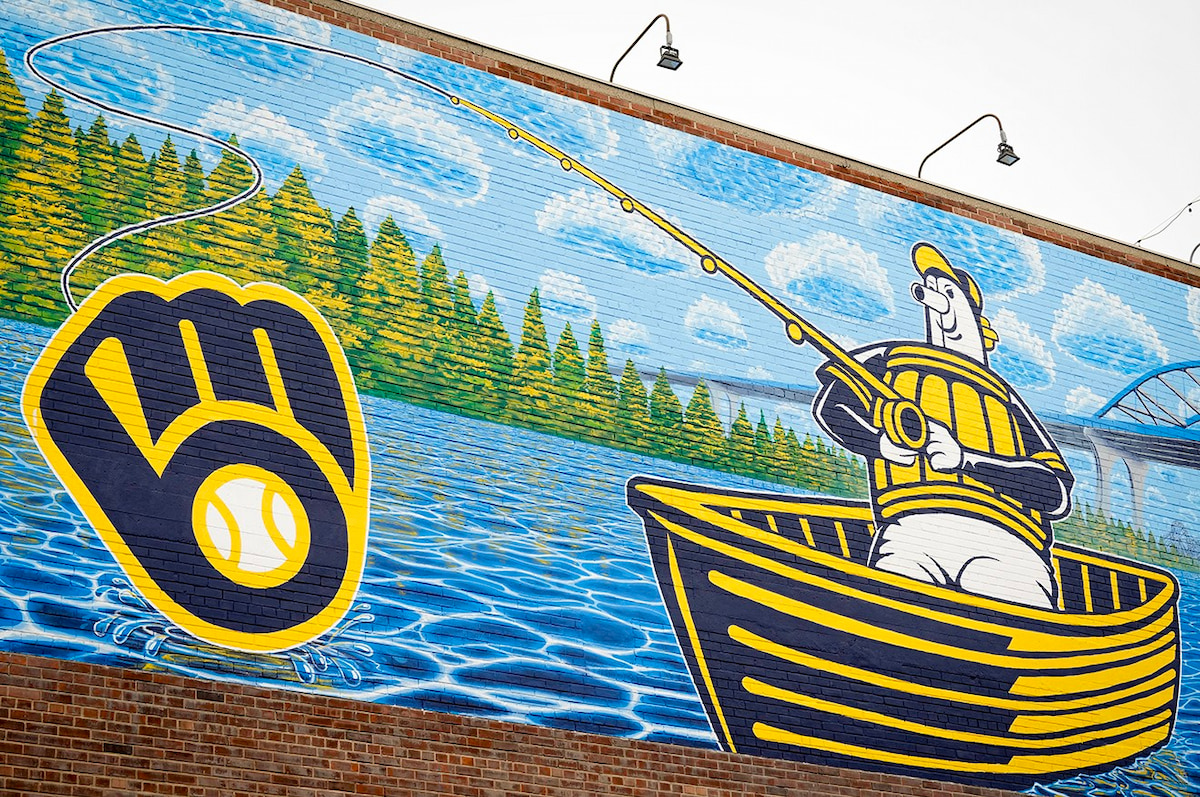 Close-up of the Milwaukee Brewers Beyond the Diamond mural painted on the Hurckman Mechanical Industries building in Green Bay, showing the vivid details of the artwork.