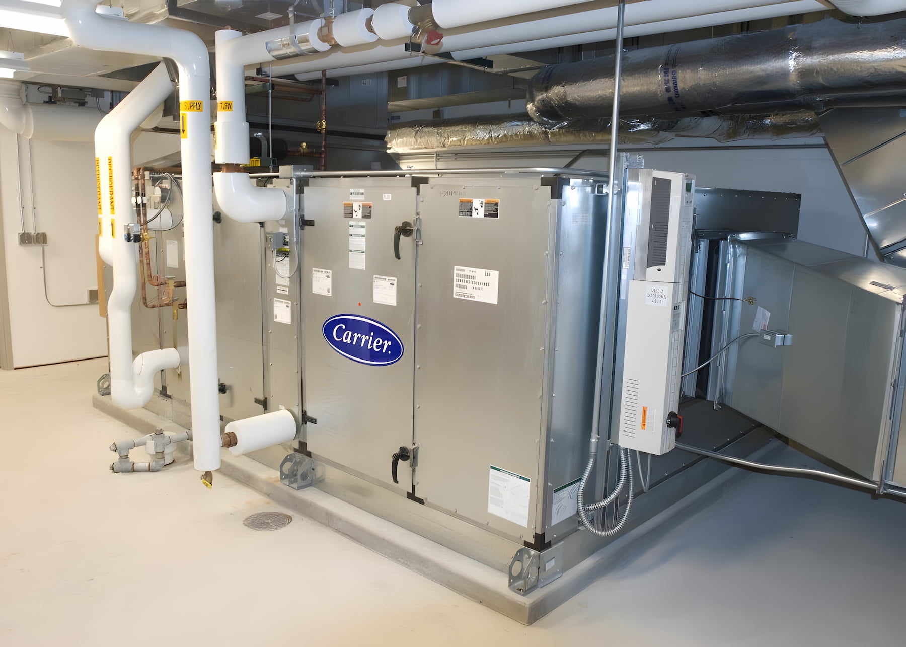 Large commercial HVAC unit installed in mechanical room
