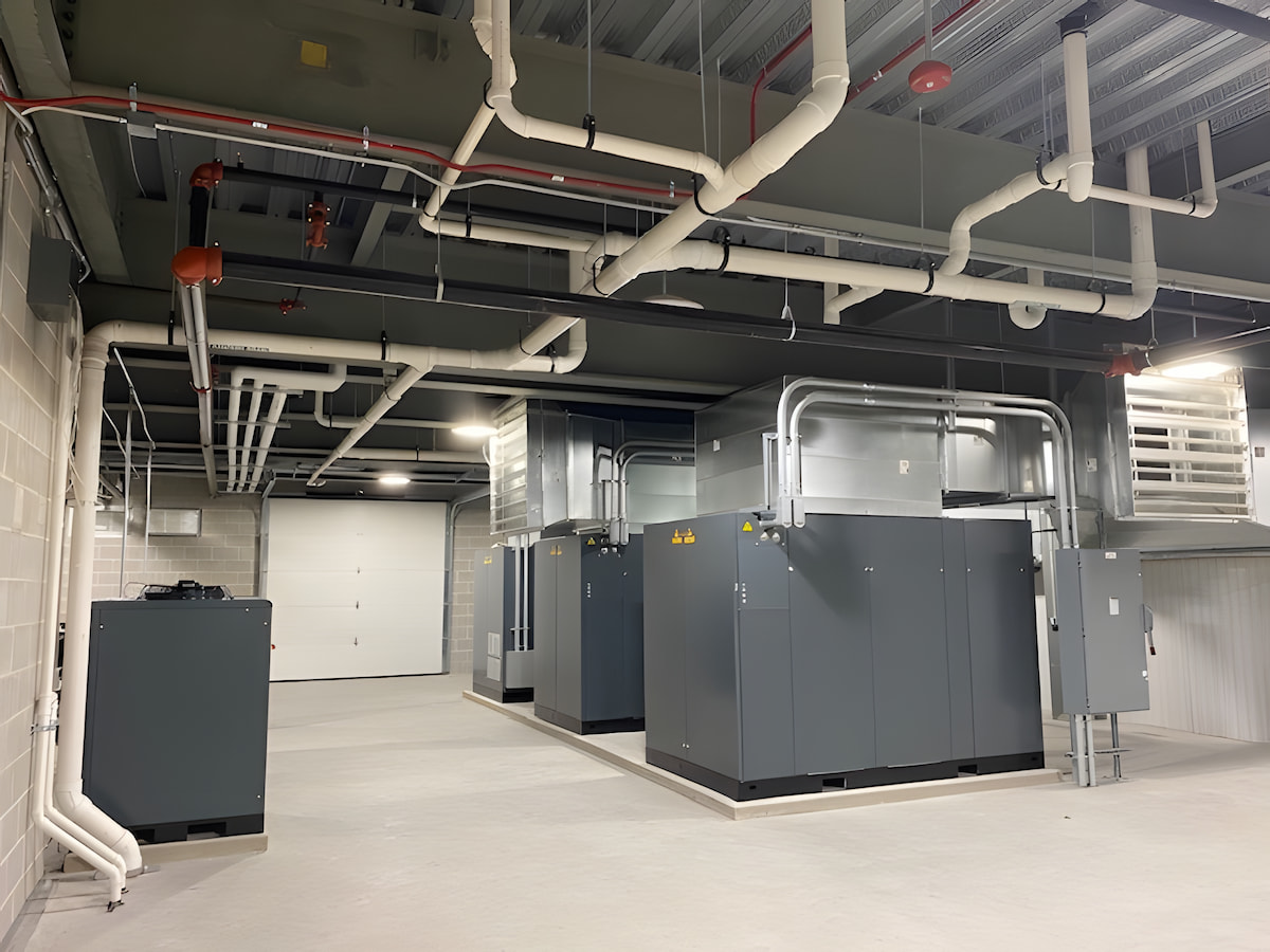 Commercial plumbing system with insulated piping and large mechanical units in Wausau, WI.