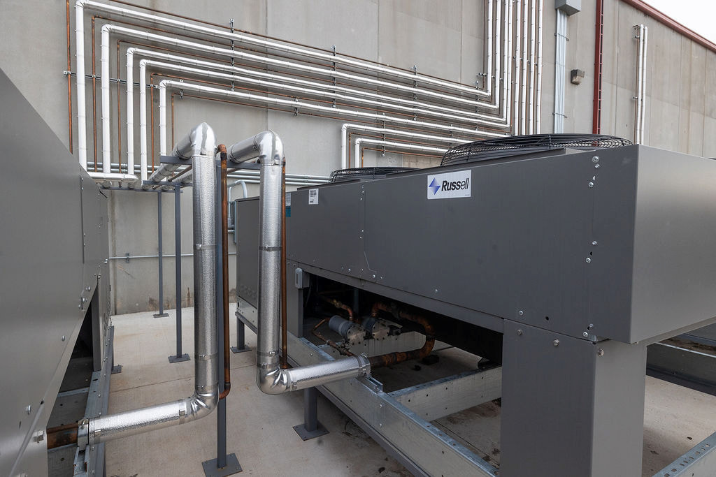 Commercial Freon refrigeration system with insulated piping and rooftop condensing units