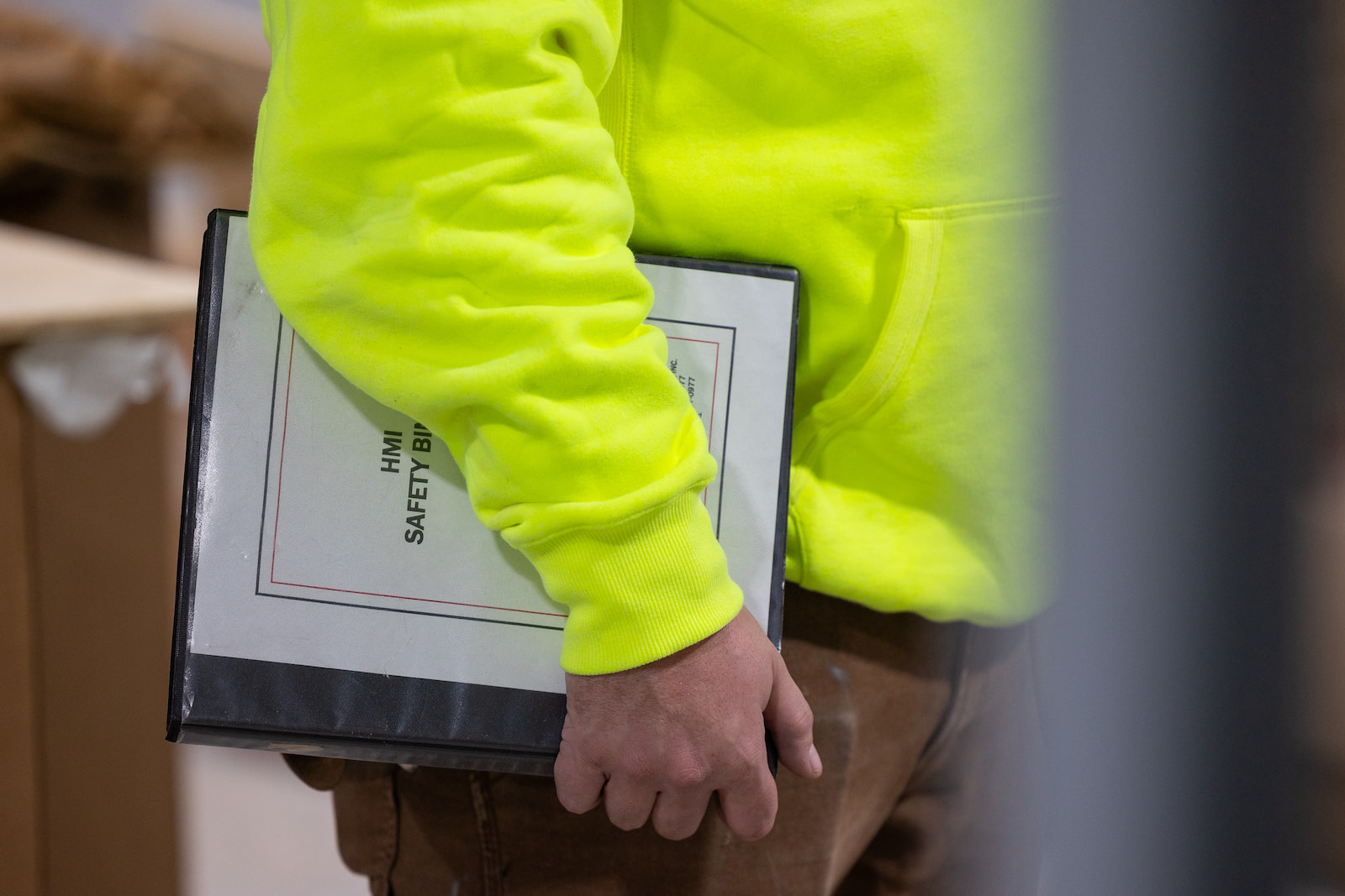 Hurckman employee holding binder of documentation