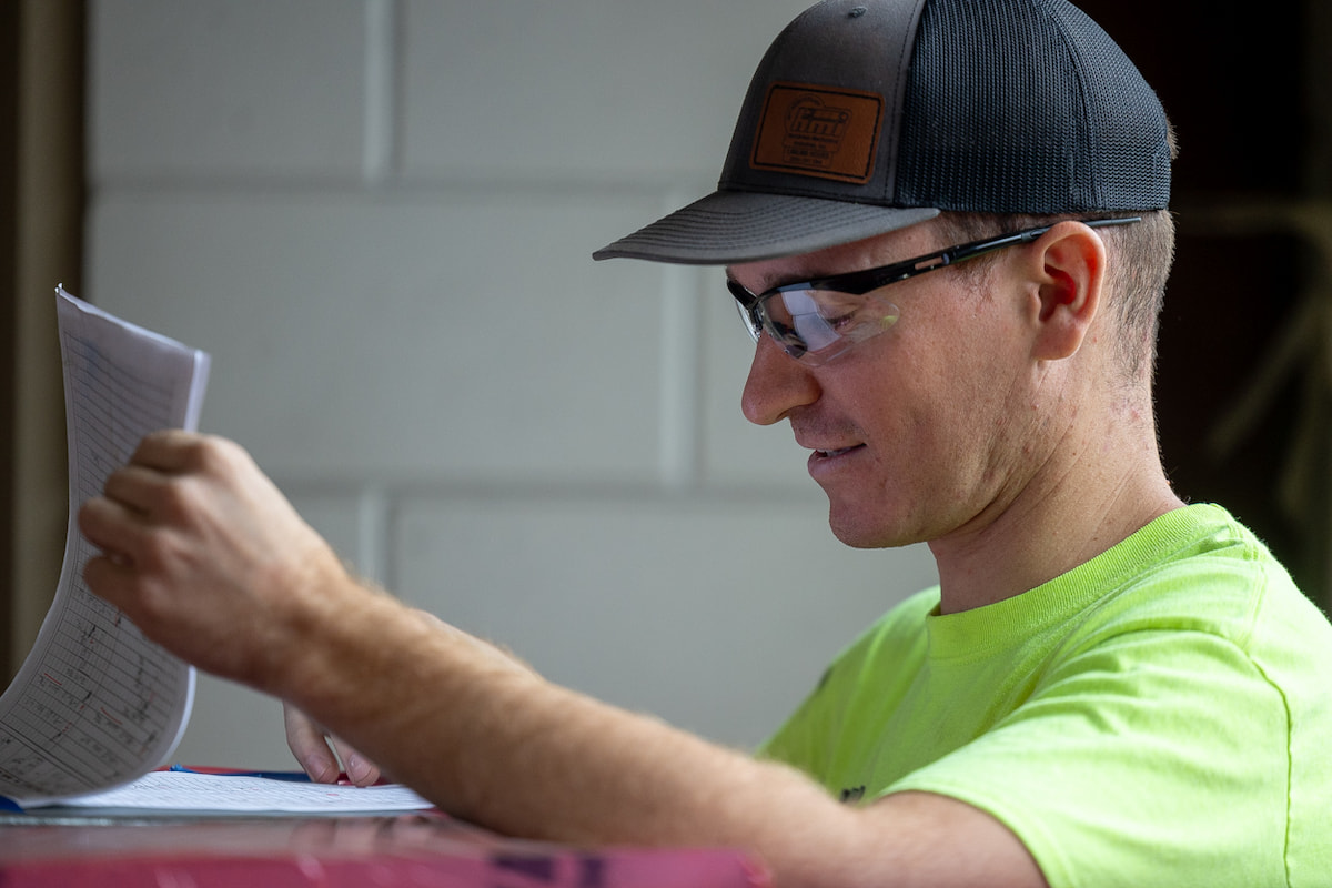 Hurckman Mechanical Technician reading project documents