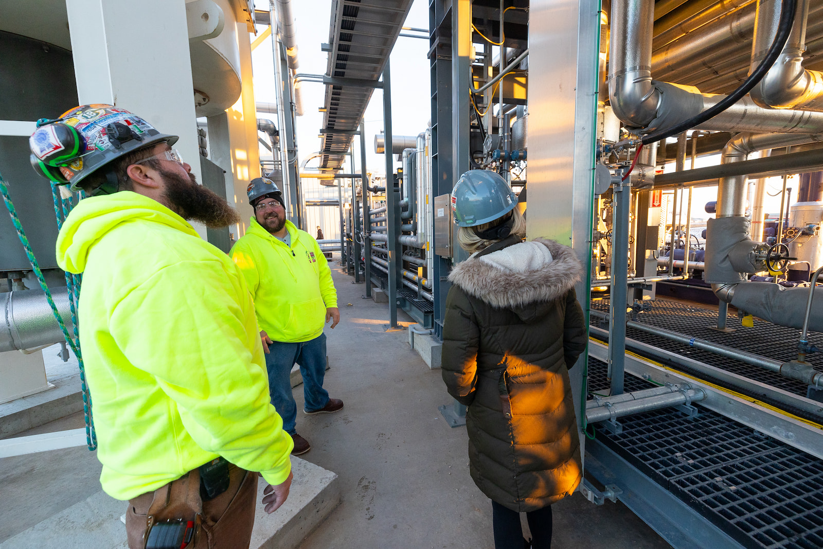 Hurckman Mechanical employees talking while on a jobsite