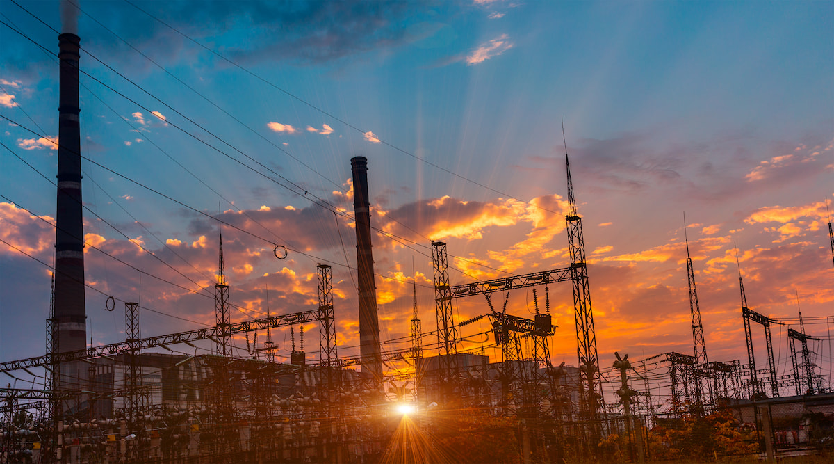 Power plant with sunset in the background