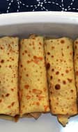 Crêpes farcies roulées dans un plat à four