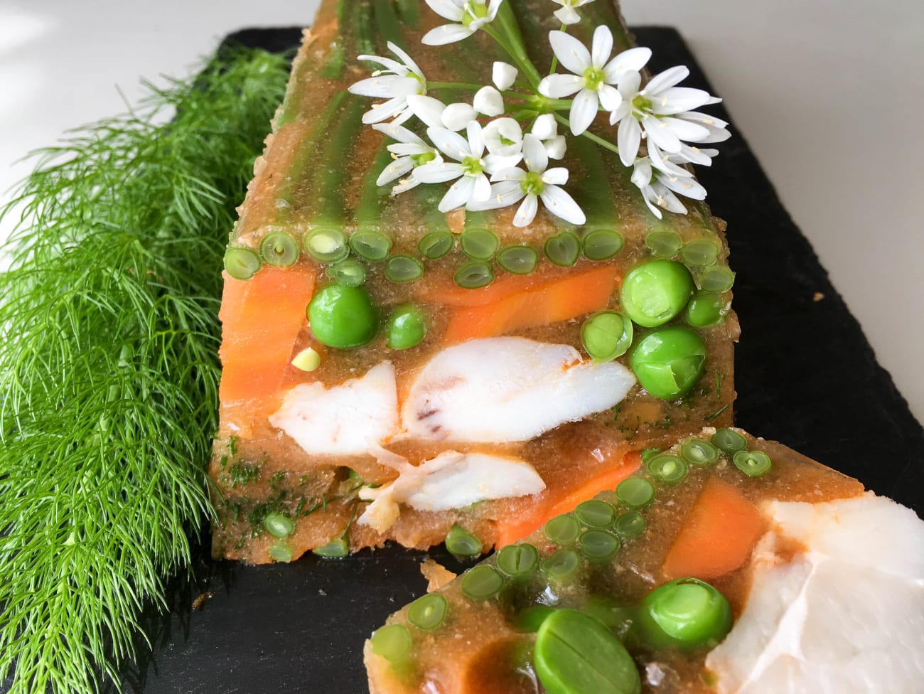 Terrine de joue de lotte et petits légumes en gelée Recette par Chef