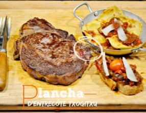 Plancha de noix d'entrecôte Txogitxu avec des ravioles farcis maison