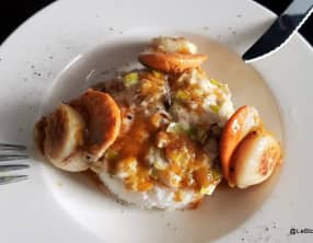 Noix de Saint-Jacques au coulis de clémentines et fondue de poireau