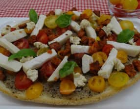 Bruschetta à la préparation aux truffes, chorizo, crottin et noix