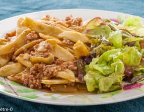 Poêlée de haricots plats aux tomates et à la chair à saucisses