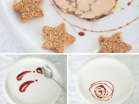 Réduction de porto et crème de framboise en décoration d'assiette