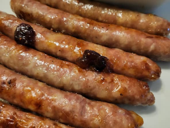 Chipolatas cuites au four façon cosmopolitan pour l'apéro