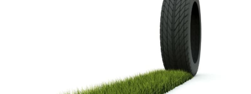 Car tyre with a trace of green grass Eco friendly tyres - do they exist?