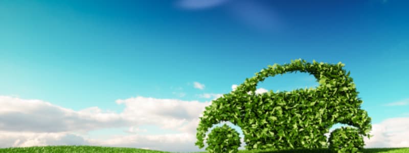 Das Auto wird immer grüner dank der neuen Abgasnormen Illustration eines grünen Autos in einer Landschaft