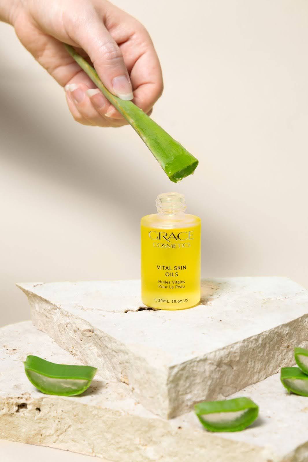 Aloe dripping into Vital Skin Oils bottle.