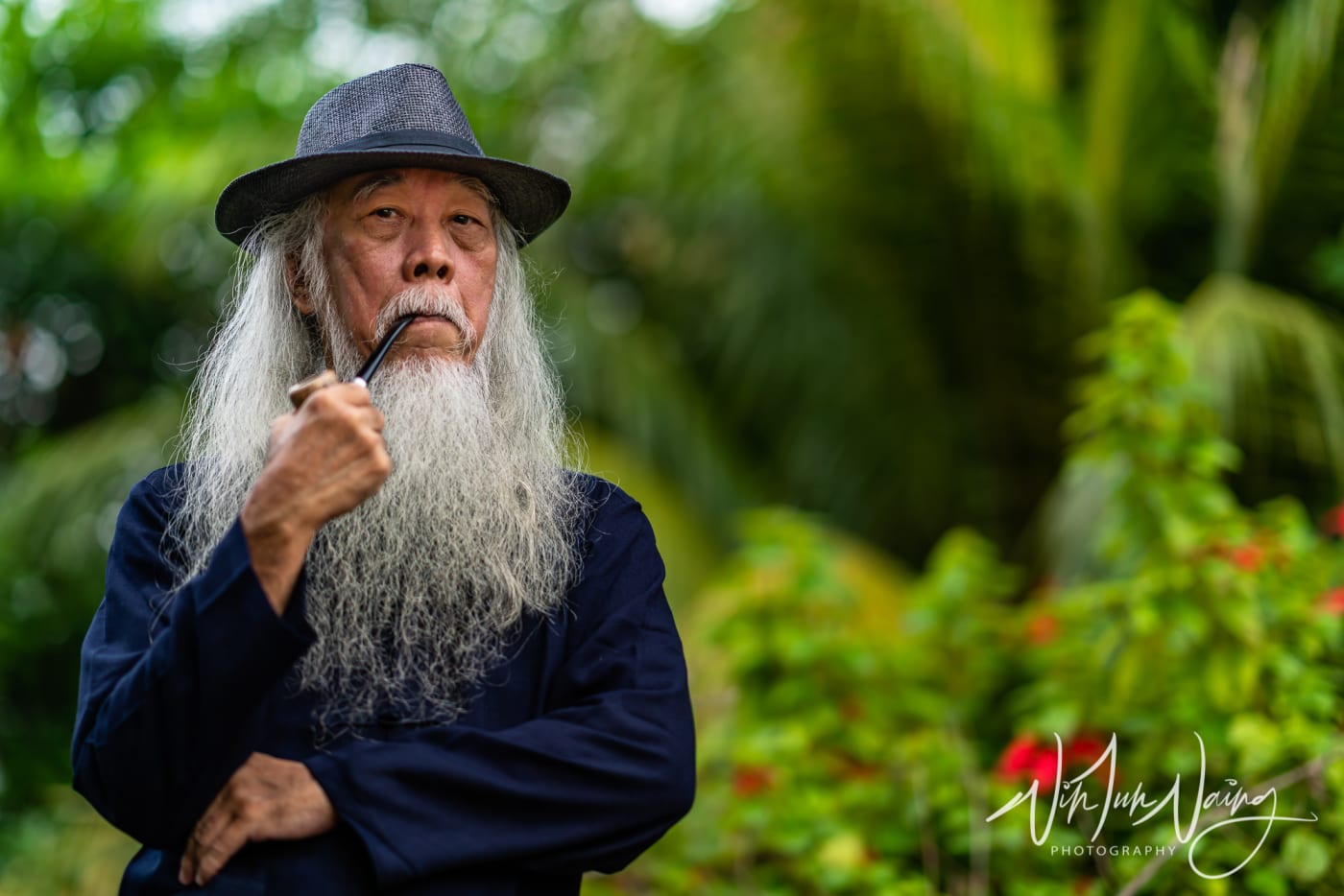 Man Holding Tobacco Pipe