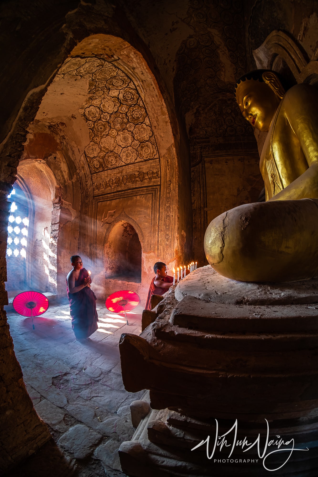 Two Novice Praying with Candle — View 01
