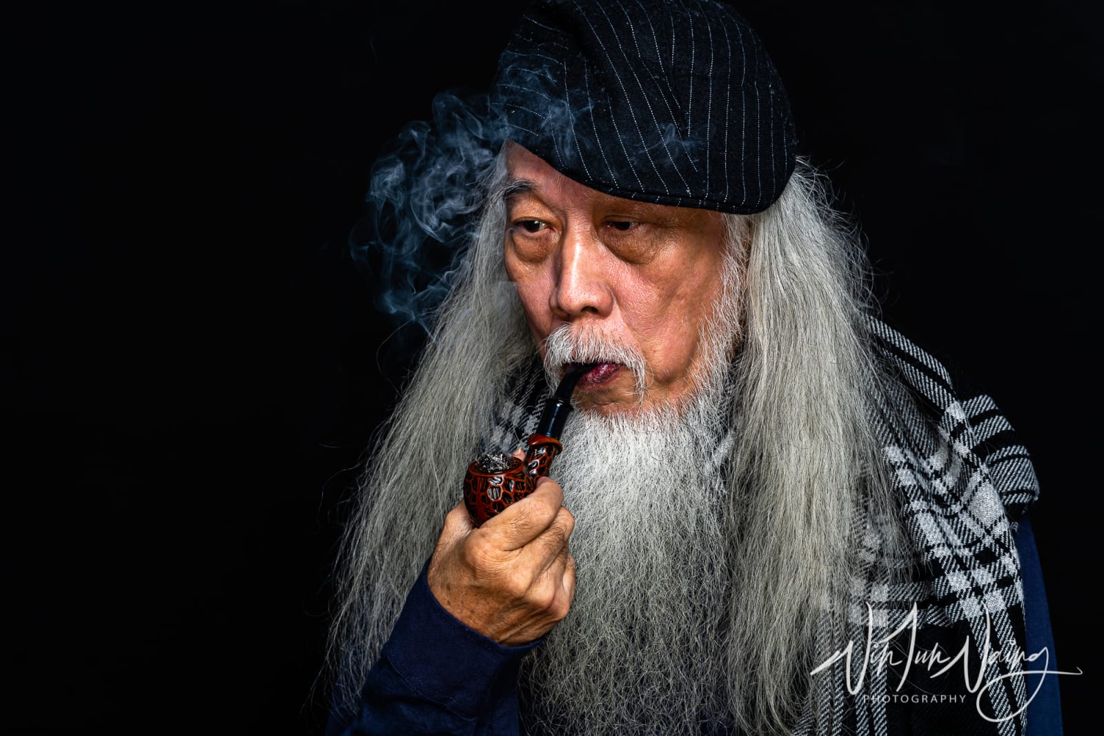 Man Smoking a Pipe — View 01
