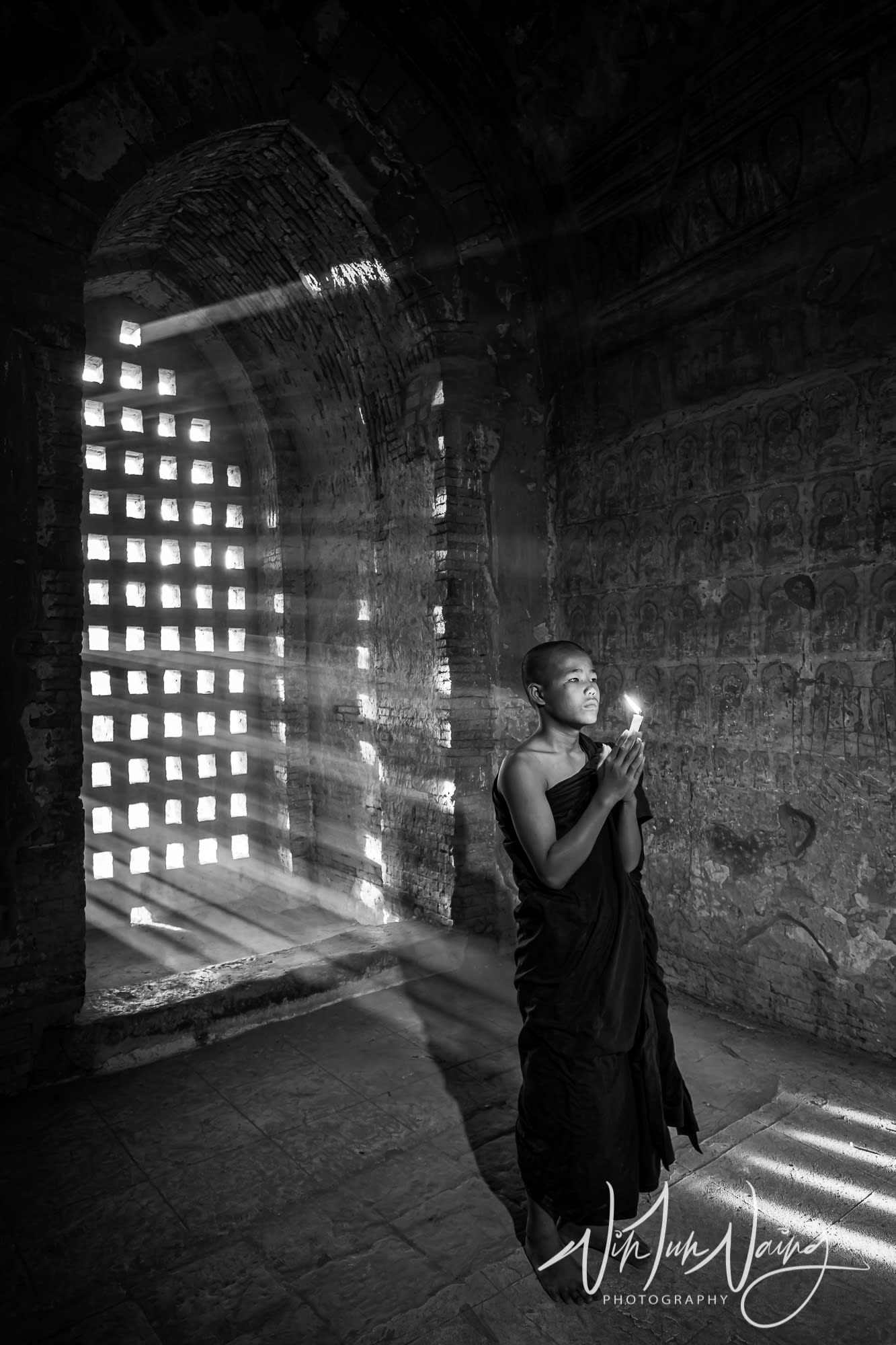A Young Novice Praying with Candle — View 01