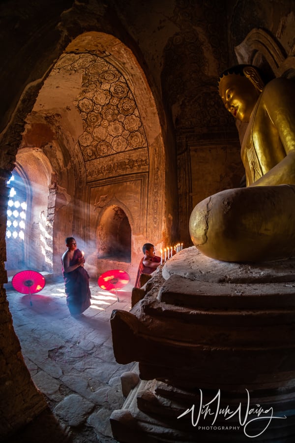 Two Novice Praying with Candle