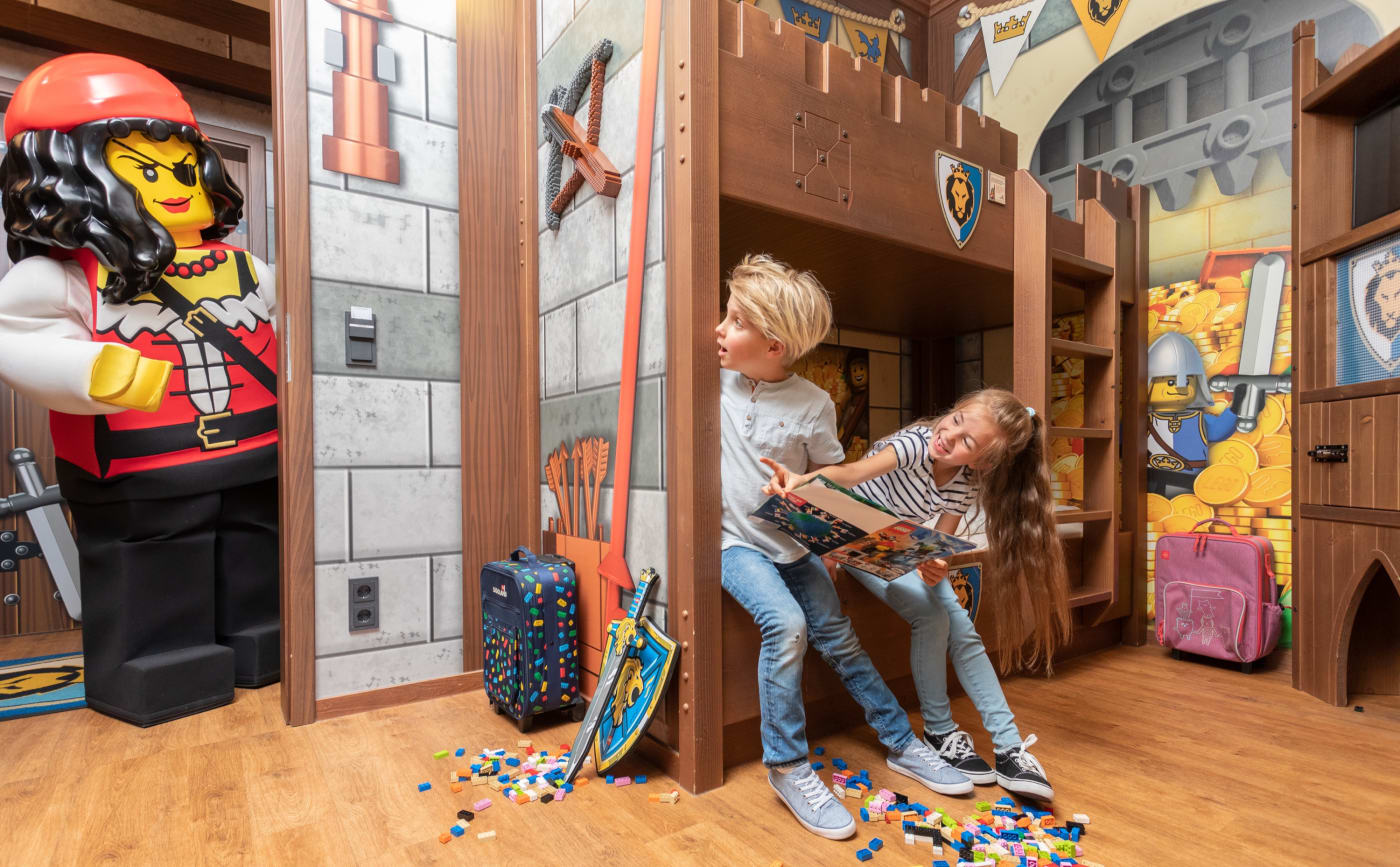 Children's area of a Dragon Castle room at Legoland Deutschland, with a cabin bed and a giant LEGO pirate
