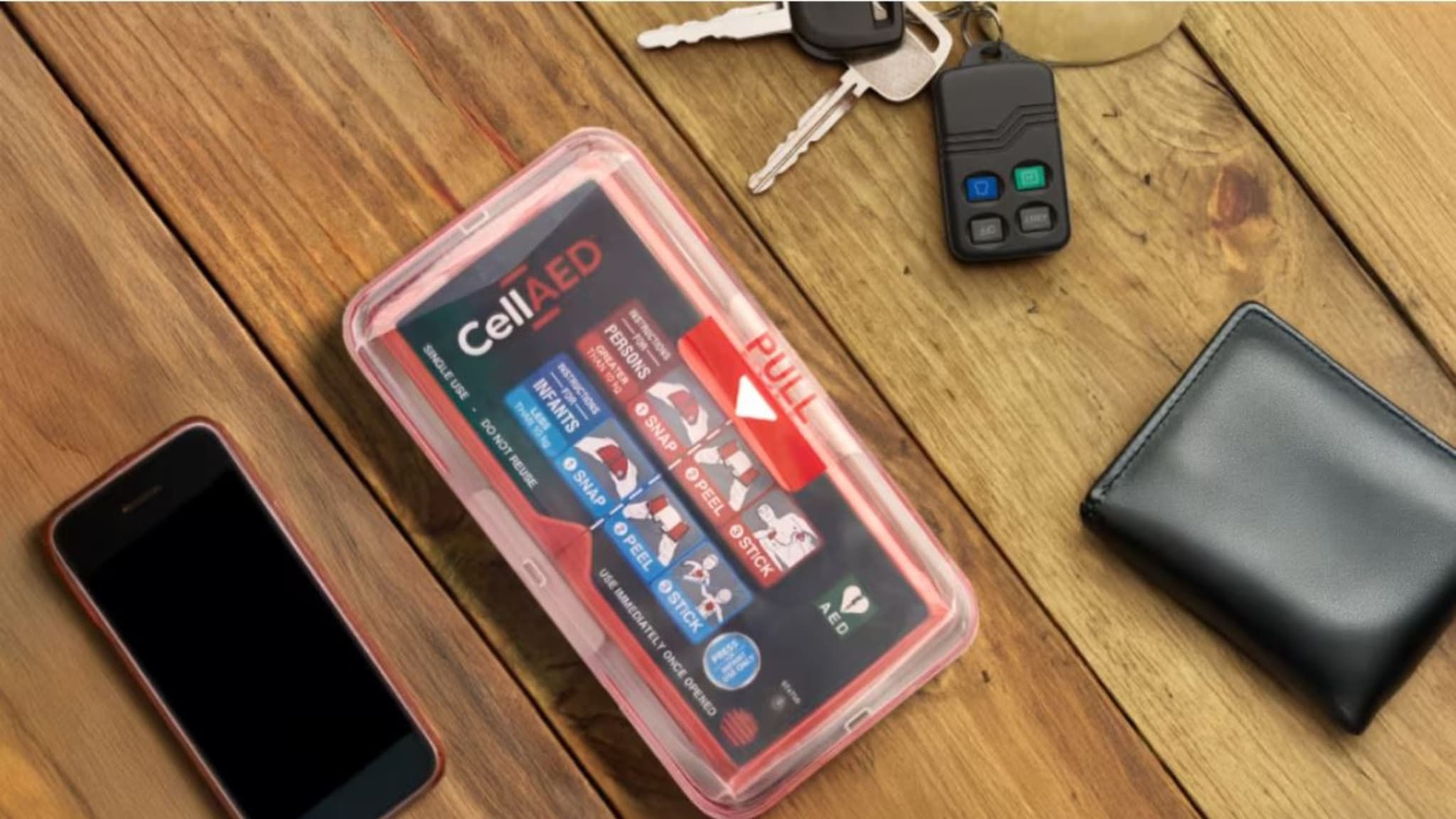 CellAED personal defibrillator with keys, phone and wallet