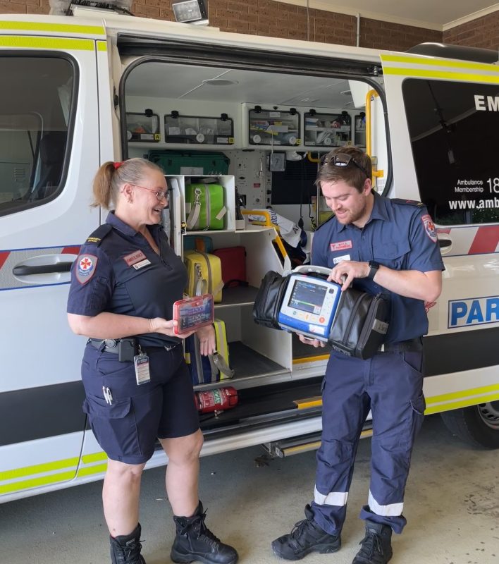 Comparing the size of a CellAED to a defibrillator carried in an ambulance.