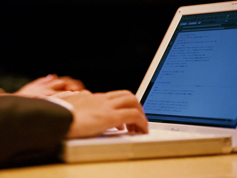 A person working at a laptop