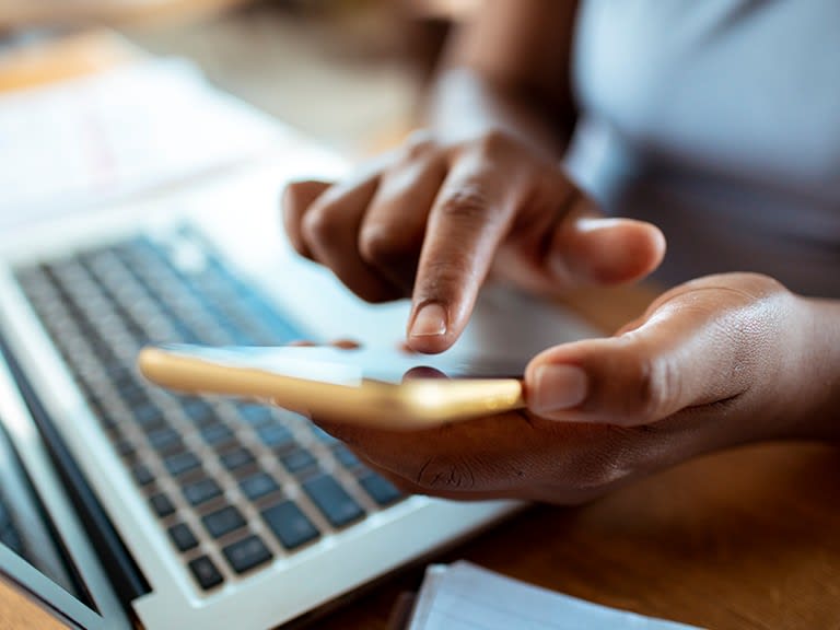 A person typing on a laptop