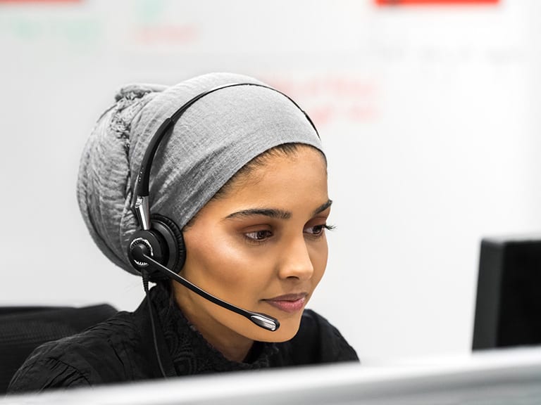 An HSBC contact centre colleague wearing a headset