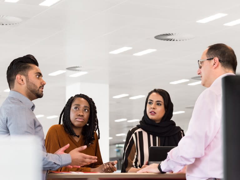 HSBC colleagues collaborating in an office