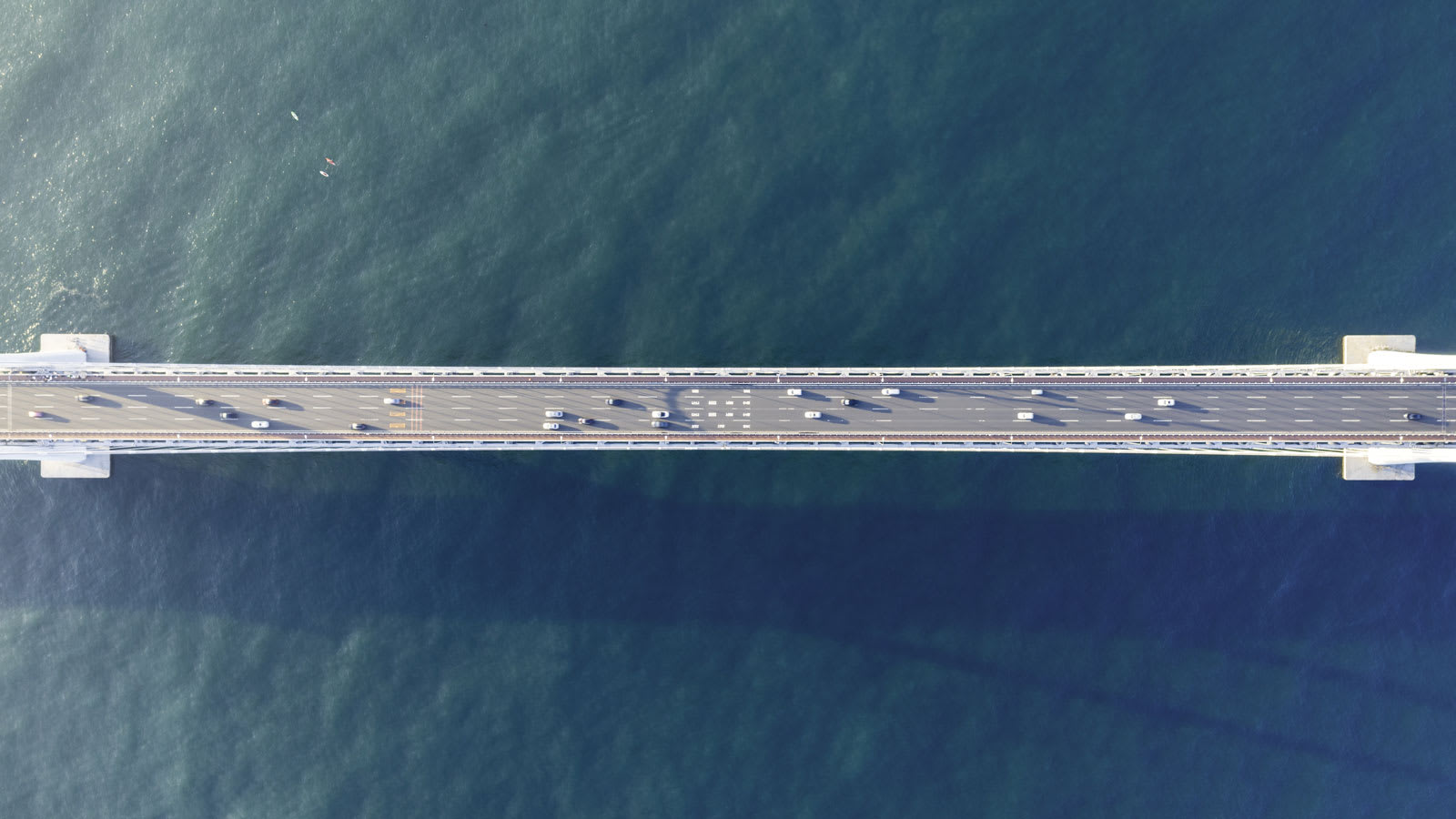 Aerial view of a bridge crossing open water