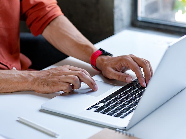 A person using a laptop securely