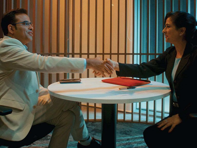 An HSBC colleague helping a customer